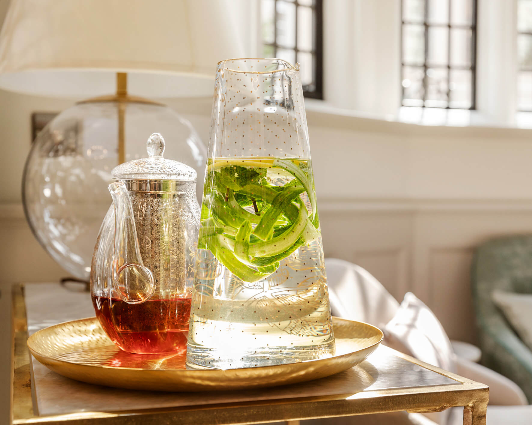 Showing tea and water with cucumber to represent fertility boosting foods