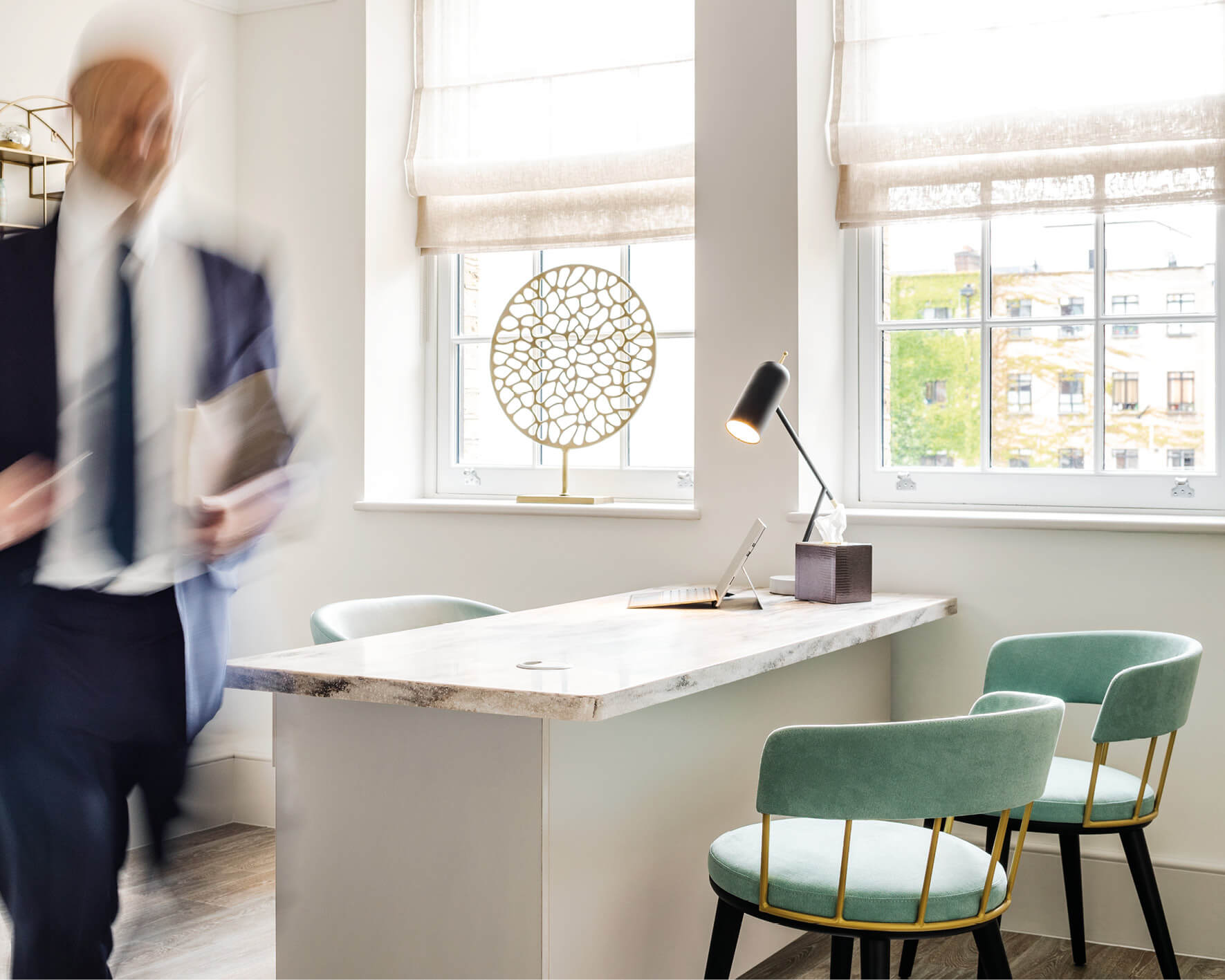 Consulting room interior showing a desk and two chairs at the Fertility Clinic
